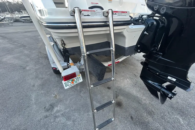 Slide: The Image of 2020 Sea Ray SPX 210 Outboard boat with ladder and outboard motor. - 86