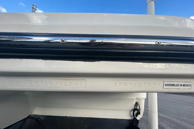 Slide: The Image of 2020 Sea Ray SPX 210 Outboard boat identification details, assembled in Mexico. - 90