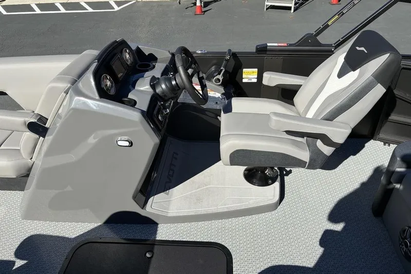 Slide: The Image of 2026 Evotti 521CS boat interior with modern steering console and comfortable seating. - 2