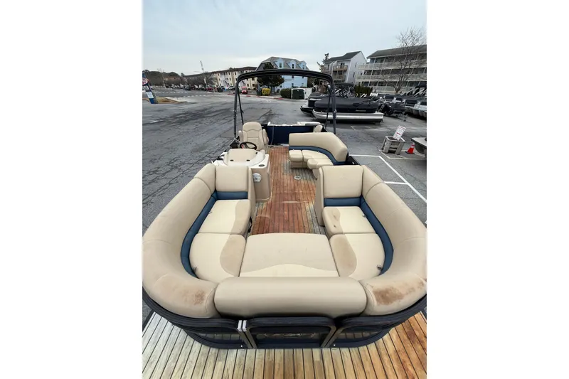 Slide: The Image of 2017 Manitou 22RF pontoon boat with spacious seating and wooden deck. - 8