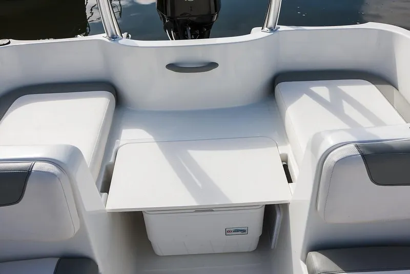 Slide: The Image of 2021 Bayliner Element E16 boat interior with blue and white seating. - 10