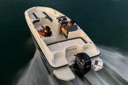 Slide: The Image of 2021 Bayliner Element E16 boat on trailer, parked outdoors. - 4