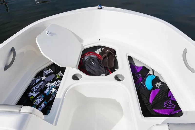 Slide: The Image of 2021 Bayliner Element E16 boat interior with storage compartments and safety equipment. - 8