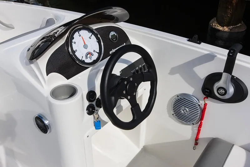 Slide: The Image of 2021 Bayliner Element E16 boat interior with blue and white seating. - 9