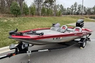 Slide: The Image of 2013 Tracker Pro Team 175 TXW fishing boat on trailer, parked outdoors. - 3