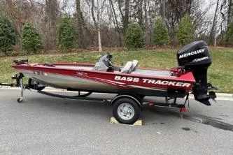 Slide: The Image of 2013 Tracker Pro Team 175 TXW bass boat with Mercury engine on trailer. - 6