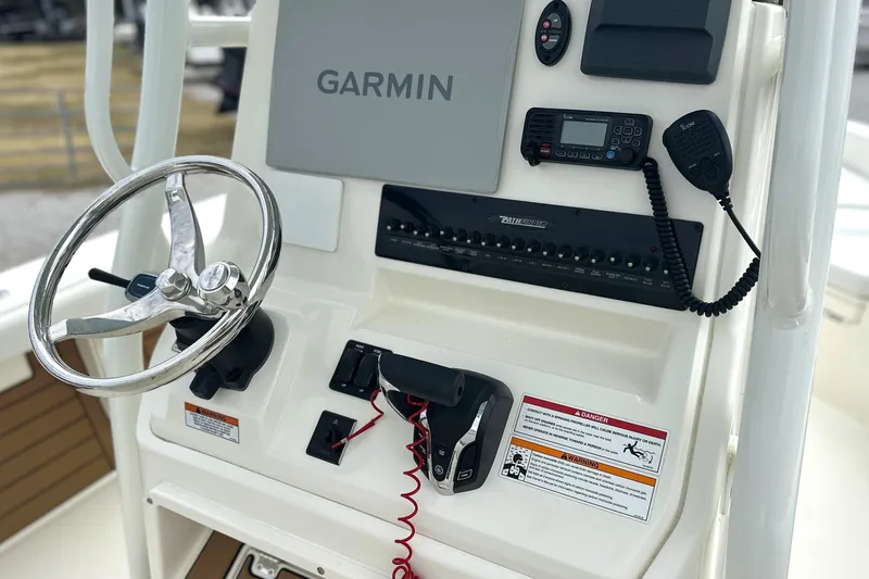 Slide: The Image of 2024 Pathfinder 2400 TRS boat console with Garmin navigation and communication equipment. - 10