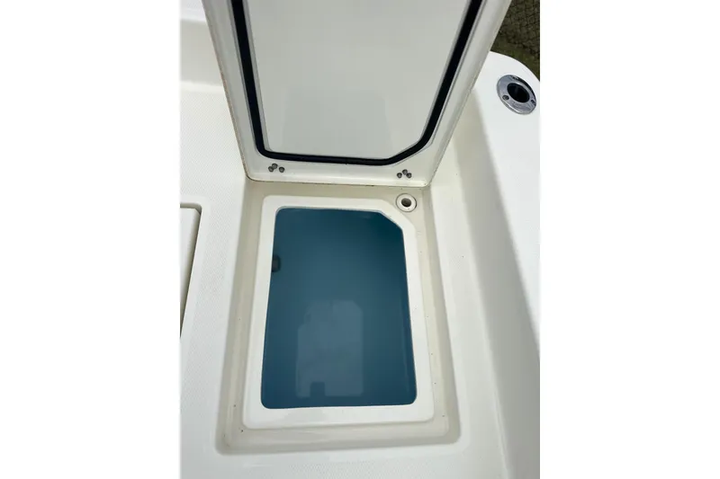 Slide: The Image of Open storage compartment on 2024 Pathfinder 2400 TRS boat. - 11