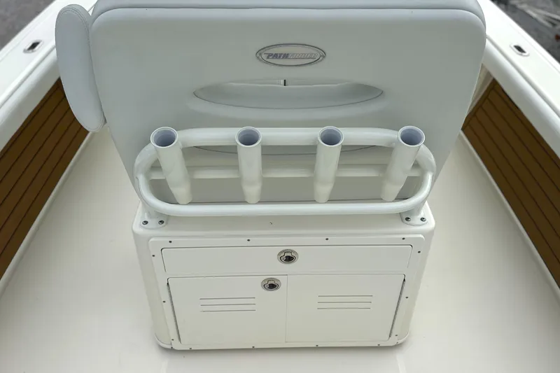 Slide: The Image of 2024 Pathfinder 2400 TRS boat seat with rod holders and storage compartment. - 13