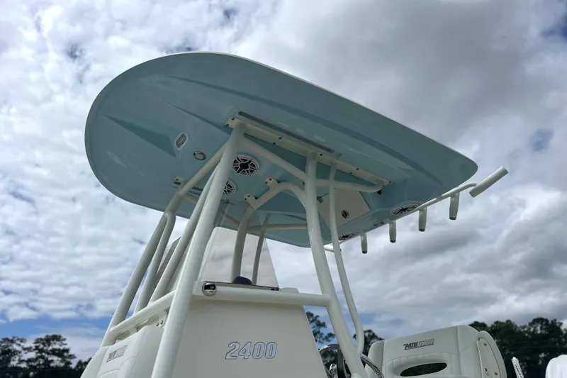 Slide: The Image of 2024 Pathfinder 2400 TRS boat with T-top against cloudy sky. - 2