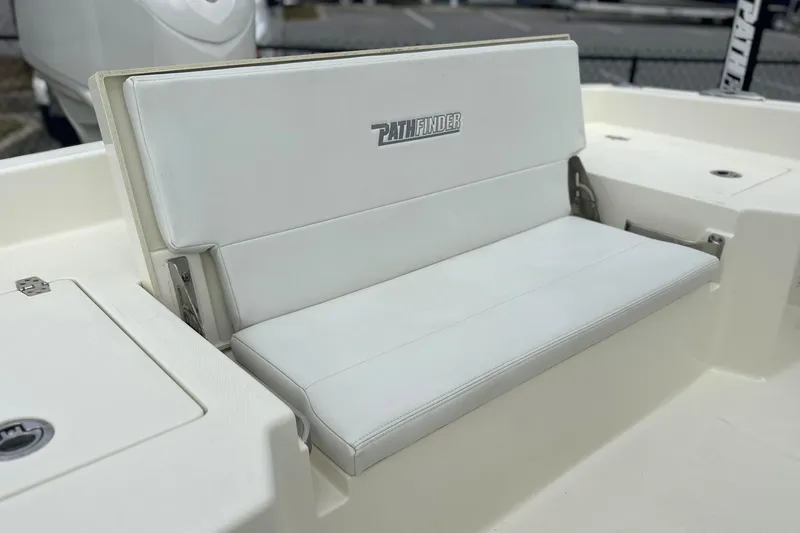 Slide: The Image of 2024 Pathfinder 2400 TRS boat with white cushioned seating. - 9