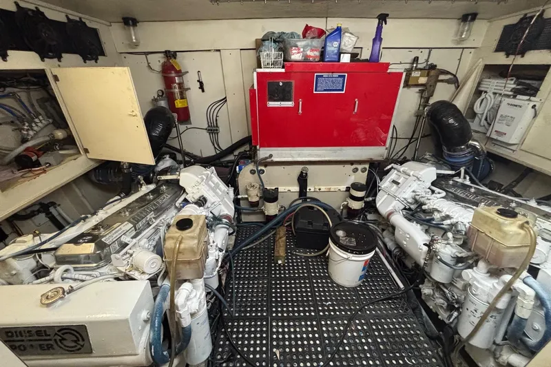 Slide: The Image of Engine room of a 1989 Ocean 48 Motor Yacht with visible machinery and equipment. - 15