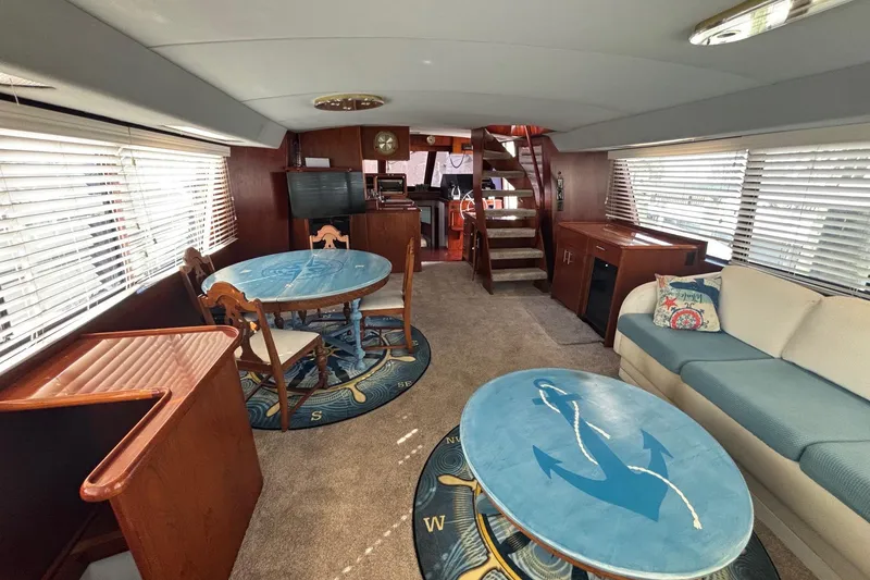 Slide: The Image of Interior of 1989 Ocean 48 Motor Yacht with nautical-themed decor and comfortable seating. - 17