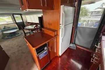 Slide: The Image of 1989 Ocean 48 Motor Yacht interior with kitchen and dining area. - 29