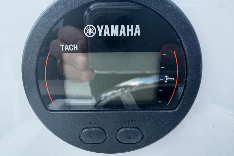 Slide: The Image of Yamaha tachometer on a 2026 Parker 180 Coastal boat dashboard. - 17