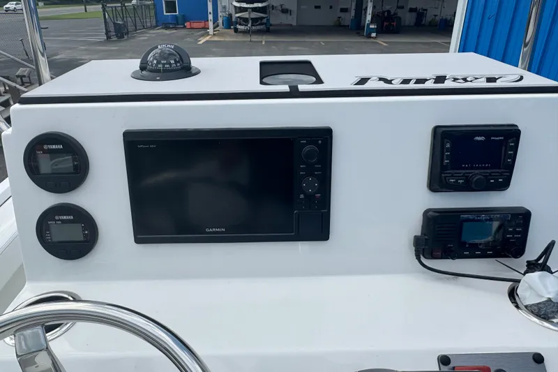 Slide: The Image of 2026 Parker 180 Coastal boat dashboard with Garmin GPS and Yamaha controls. - 20