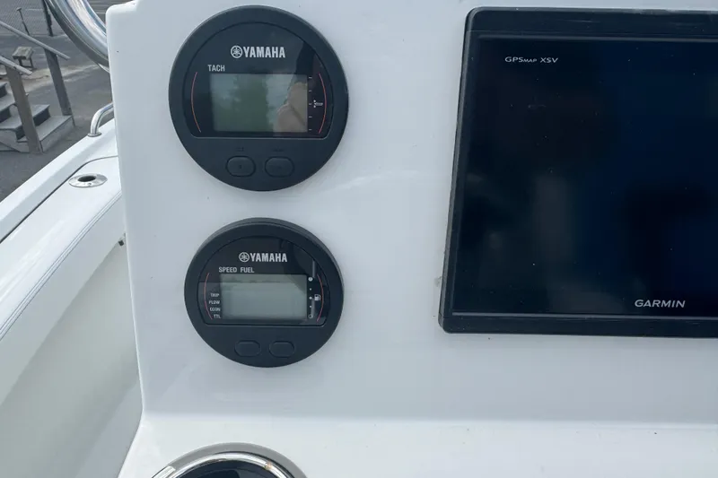 Slide: The Image of Yamaha gauges and Garmin GPS on 2026 Parker 180 Coastal boat dashboard. - 23