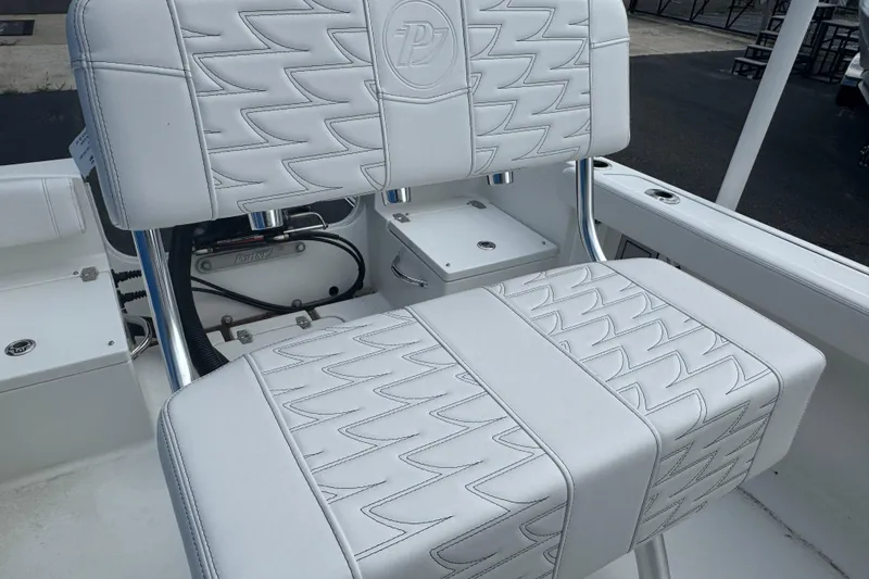 Slide: The Image of White leather seating on 2026 Parker 180 Coastal boat, featuring stylish stitching and chrome accents. - 7