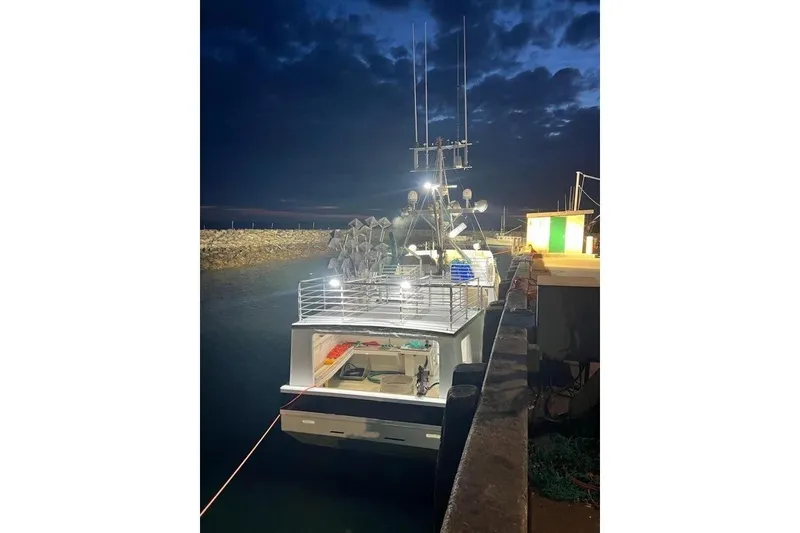 Slide: The Image of Commercial Long Liner boat docked at night, illuminated, 1992 model. - 5