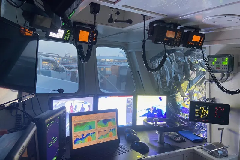 Slide: The Image of Interior of a 1992 Commercial Long Liner boat with advanced navigation equipment. - 9