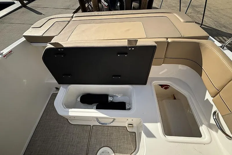 Slide: The Image of 2023 Bayliner VR5 Bowrider OB boat interior with open storage compartments. - 13