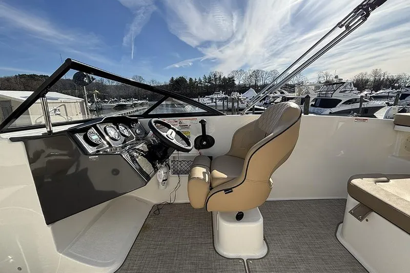 Slide: The Image of 2023 Bayliner VR5 Bowrider OB cockpit with steering wheel and comfortable seating. - 14