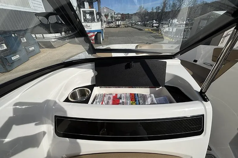 Slide: The Image of 2023 Bayliner VR5 Bowrider OB interior with storage compartment and cup holder. - 20
