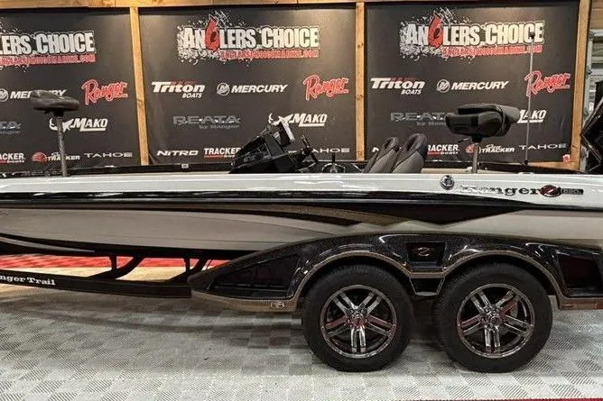 The Image of 2020 Ranger Z520L boat displayed at Angler's Choice event with branded backdrop. - 1