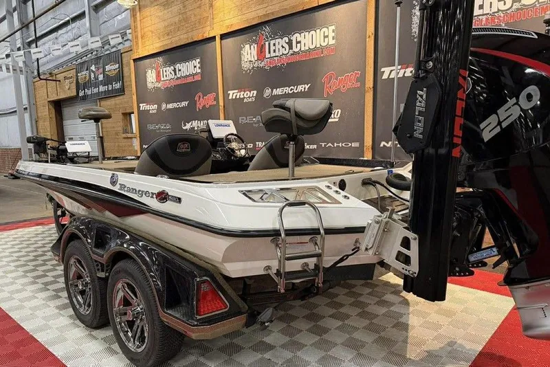 Slide: The Image of 2020 Ranger Z520L boat displayed indoors with powerful engine and sleek design. - 4