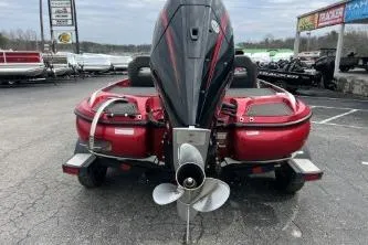 Slide: The Image of 2021 Nitro Z19 Pro boat, rear view, red color, parked outdoors. - 3