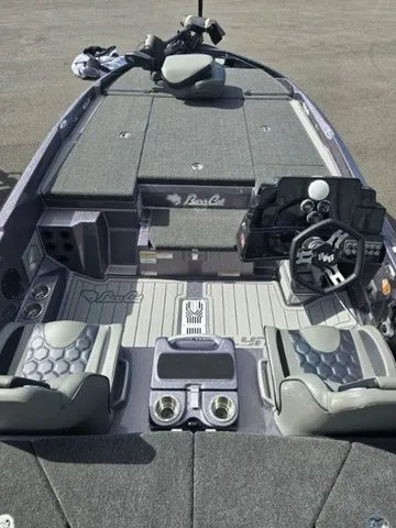 Slide: The Image of 2025 Bass Cat Lynx STS boat interior with modern seating and advanced dashboard controls. - 2