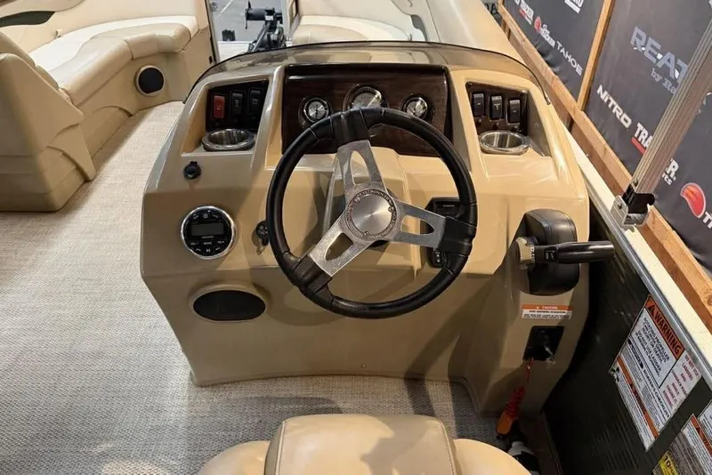 Slide: The Image of 2018 Bennington 21 SLX boat dashboard with steering wheel and controls. - 7