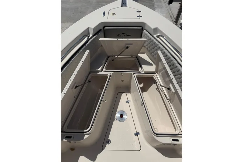 Slide: The Image of 2023 Sea Chaser 24 HFC boat interior with open storage compartments. - 12