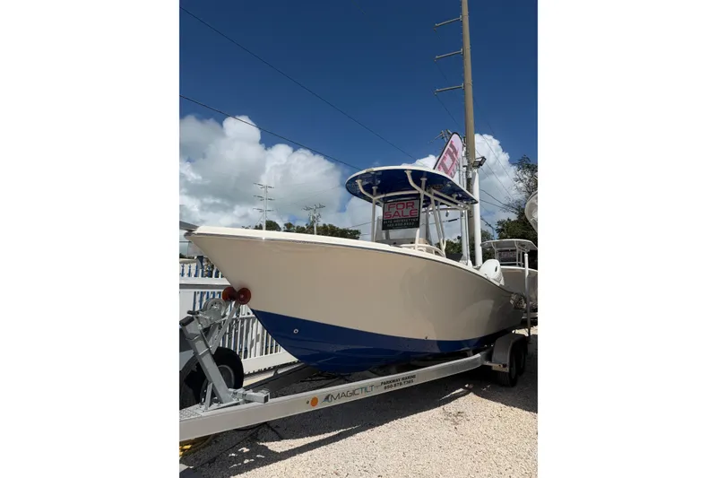 Slide: The Image of 2023 Sea Chaser 24 HFC boat on trailer, for sale under clear sky. - 25