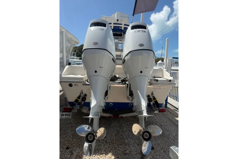 Slide: The Image of 2023 Sea Chaser 24 HFC boat with dual outboard motors, rear view. - 4