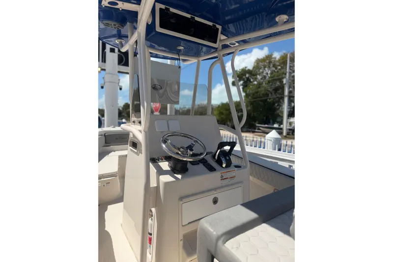 Slide: The Image of 2023 Sea Chaser 24 HFC boat interior with steering console and seating. - 6