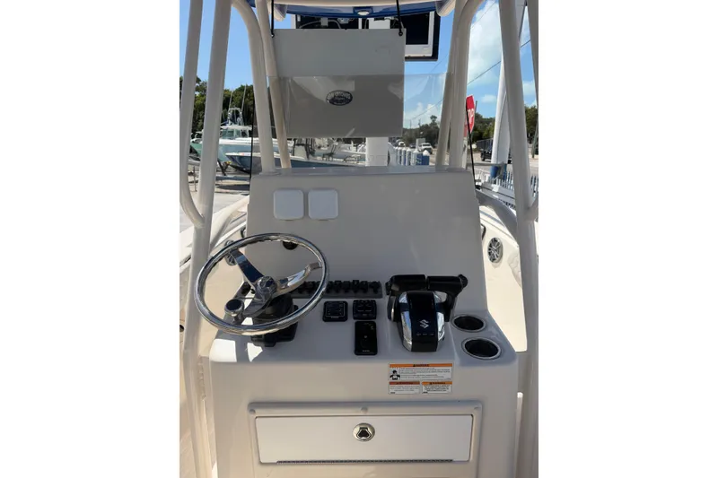 Slide: The Image of 2023 Sea Chaser 24 HFC boat console with steering wheel and controls. - 7