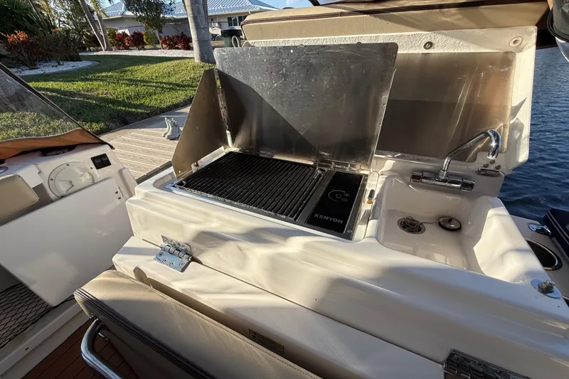 Slide: The Image of Outdoor kitchen on 2022 Ranger Tugs R-27 boat with grill and sink. - 22