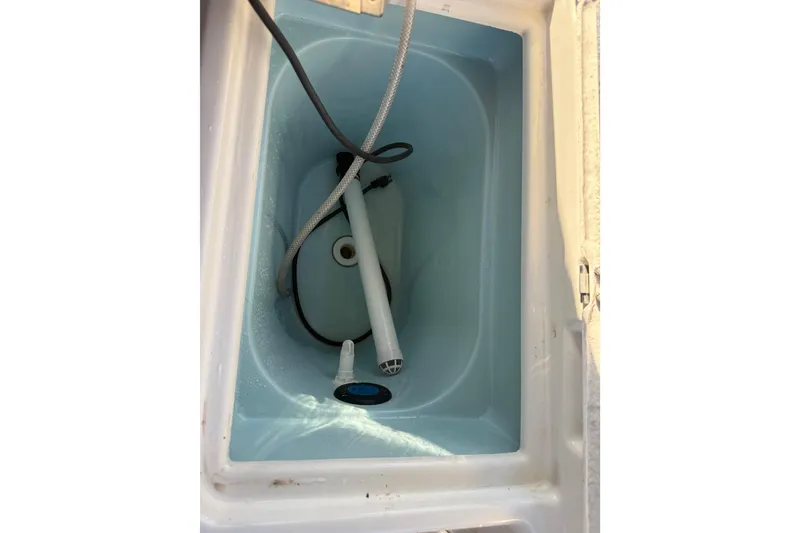 Slide: The Image of 2022 Ranger Tugs R-27 boat compartment with hoses and fittings. - 29