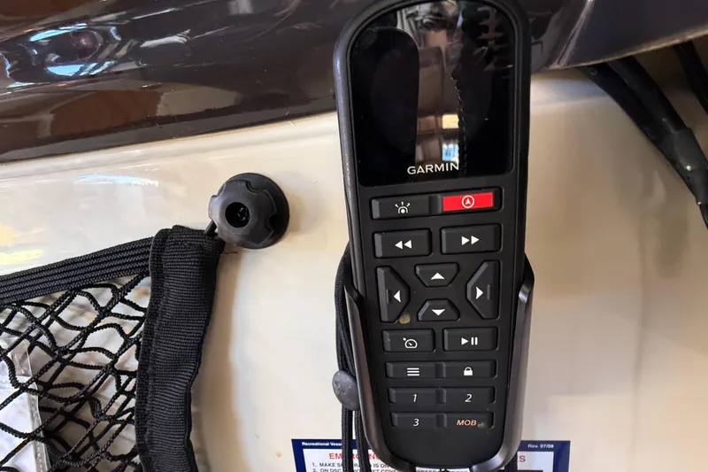 Slide: The Image of Garmin marine radio on 2022 Ranger Tugs R-27 boat dashboard. - 36