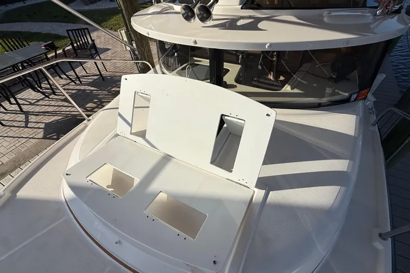 Slide: The Image of 2022 Ranger Tugs R-27 boat deck with open hatch, dockside view. - 71