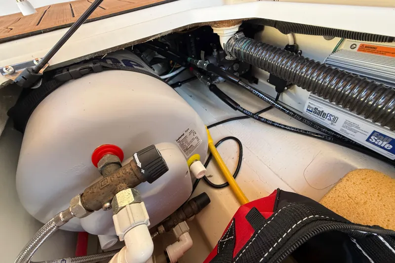 Slide: The Image of Interior view of 2022 Ranger Tugs R-27 boat showing mechanical components and storage area. - 81