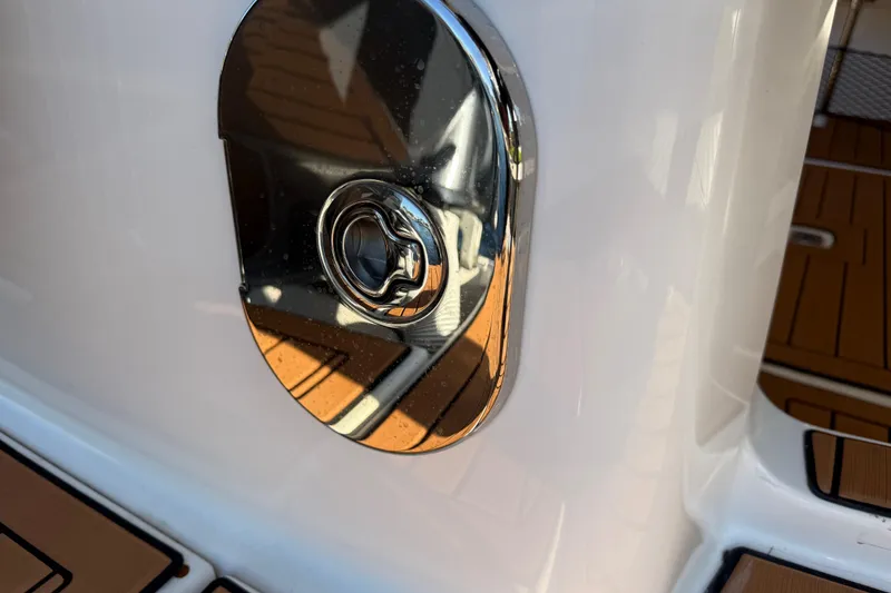Slide: The Image of Close-up of a 2022 Ranger Tugs R-27 boat's chrome detail on deck. - 83