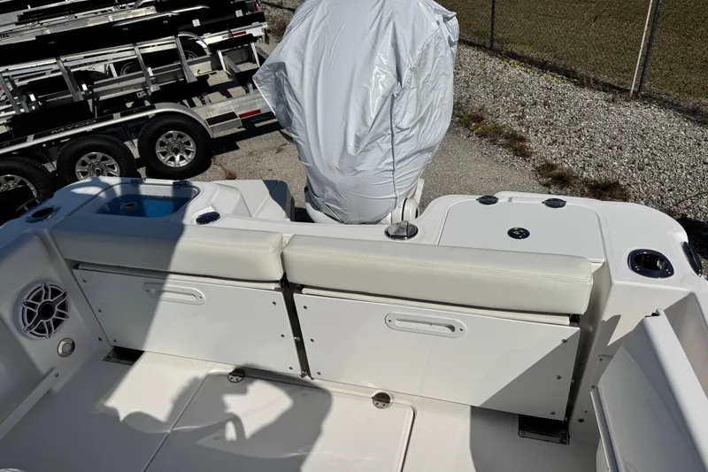 Slide: The Image of 2024 Everglades 235 Center Console boat interior with seating and storage compartments. - 6