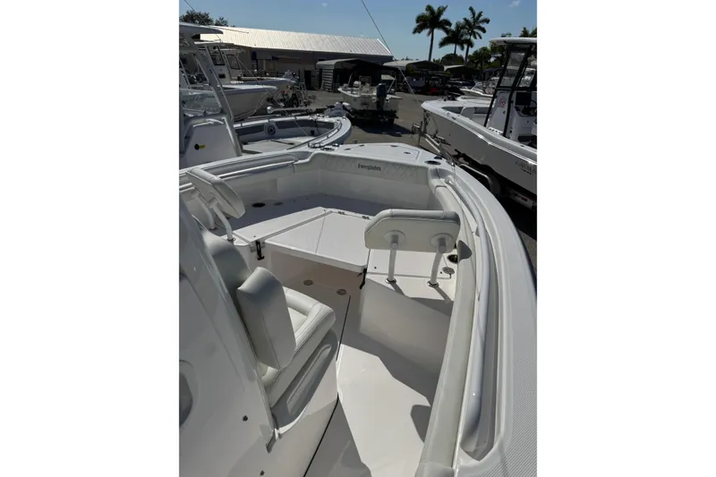 Slide: The Image of 2024 Everglades 235 Center Console boat interior with seating and console view. - 8