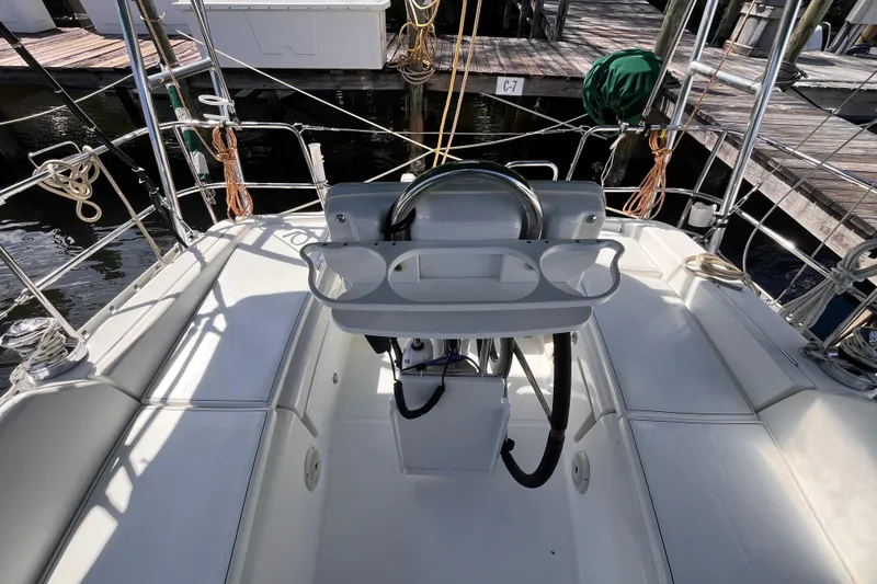 Slide: The Image of Cockpit view of 2008 Beneteau Oceanis 343 sailboat, featuring steering wheel and seating. - 10