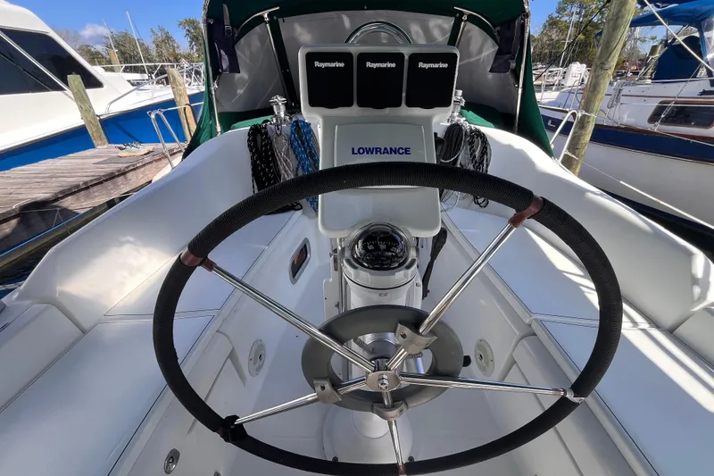 Slide: The Image of Cockpit of 2008 Beneteau Oceanis 343 sailboat with steering wheel and navigation equipment. - 11