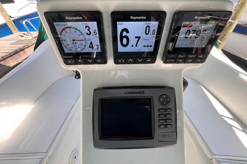 Slide: The Image of Beneteau Oceanis 343 2008 sailboat cockpit with Raymarine and Lowrance navigation displays. - 13