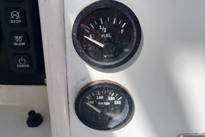 Slide: The Image of Fuel and water gauges on a 2008 Beneteau Oceanis 343 sailboat dashboard. - 16