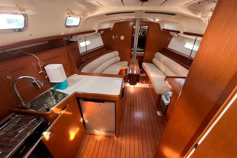 Slide: The Image of Interior of 2008 Beneteau Oceanis 343 sailboat with wood finish and modern amenities. - 19